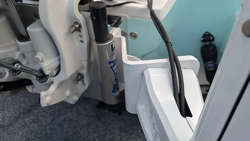 Slide: The Image of Close-up of the 2024 Key West 230 Bay Reef boat's engine and hydraulic system. - 5