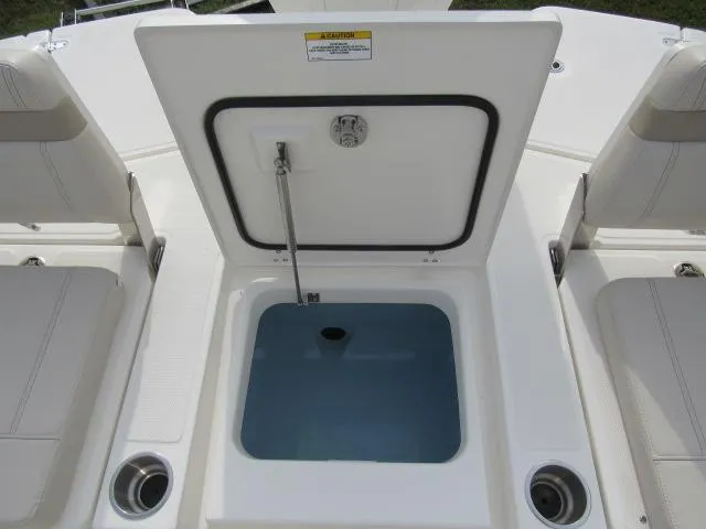 Slide: The Image of Open storage compartment on 2024 Boston Whaler 250 Dauntless boat. - 10