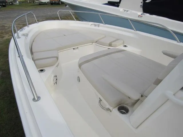 Slide: The Image of 2024 Boston Whaler 250 Dauntless boat interior with cushioned seating. - 16