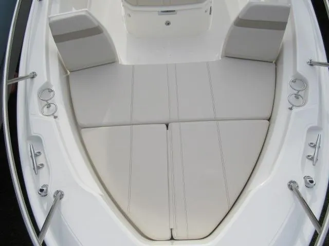 Slide: The Image of 2024 Boston Whaler 250 Dauntless bow seating area with cushioned seats. - 19