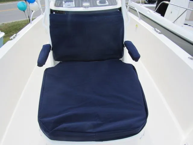 Slide: The Image of 2024 Boston Whaler 250 Dauntless boat with navy blue cushioned seating. - 23