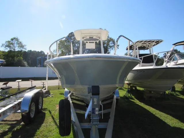 Slide: The Image of 2024 Boston Whaler 250 Dauntless boat on a trailer, front view. - 29