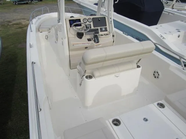 Slide: The Image of 2024 Boston Whaler 250 Dauntless boat interior with helm station and seating. - 3