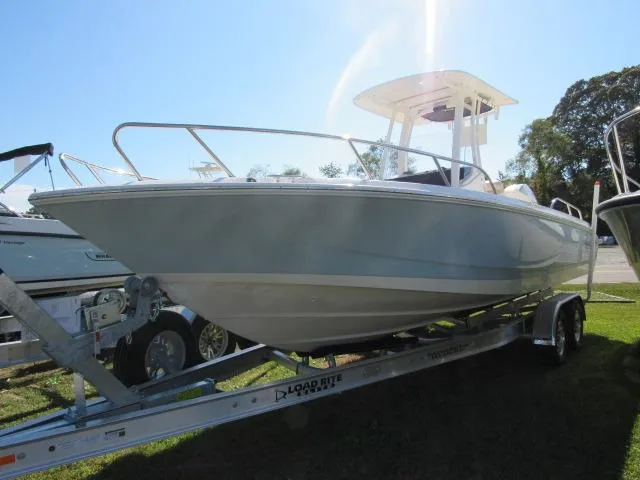 Slide: The Image of 2024 Boston Whaler 250 Dauntless boat on a trailer, side view. - 30