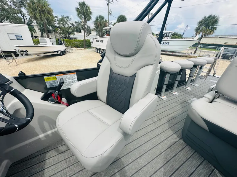 Slide: The Image of 2023 Starcraft CX 23 DL BAR pontoon boat with Yamaha outboard engine on trailer. - 10
