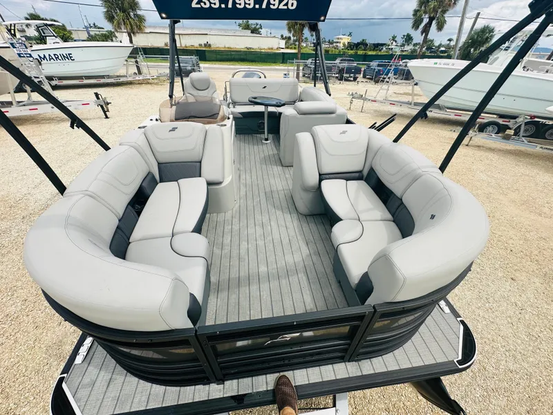 Slide: The Image of 2023 Starcraft CX 23 DL BAR boat interior with open storage compartments. - 15
