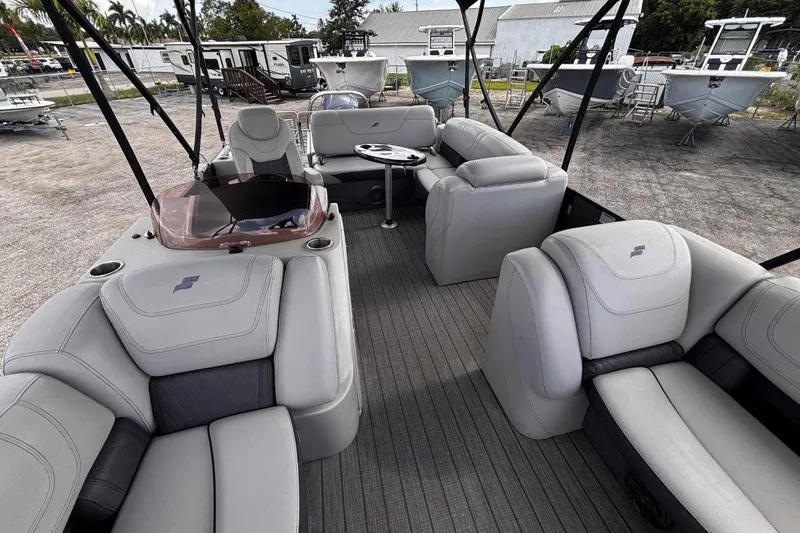 Slide: The Image of 2023 Starcraft CX 23 DL BAR pontoon boat with luxurious seating and modern design. - 19