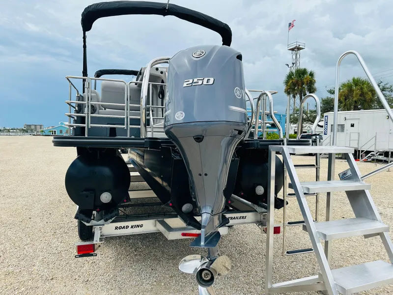 Slide: The Image of 2023 Starcraft CX 23 DL BAR pontoon boat on Ryco Marine trailer. - 3