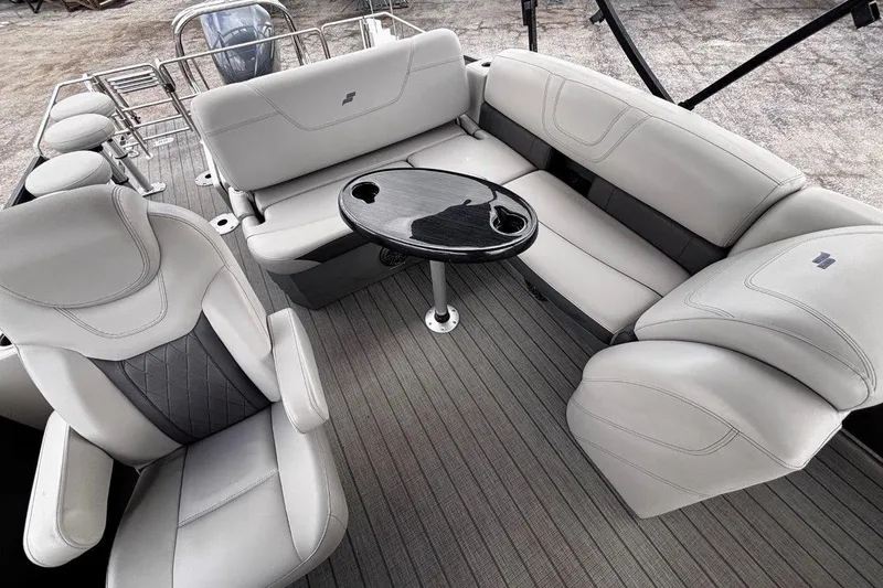 Slide: The Image of 2023 Starcraft CX 23 DL BAR boat interior with luxurious seating and sleek table design. - 36