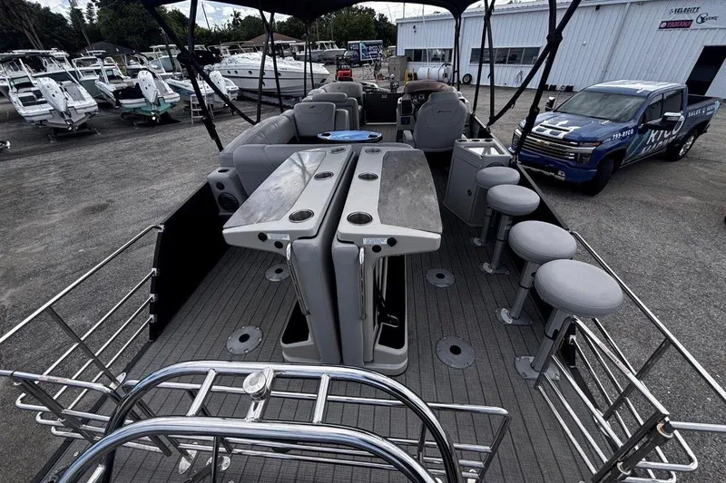 Slide: The Image of 2023 Starcraft CX 23 DL BAR pontoon boat with bar seating and modern interior. - 43