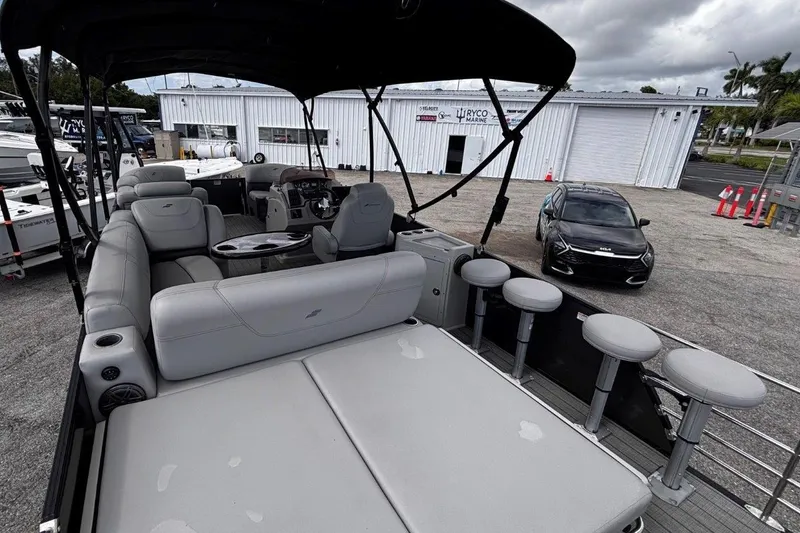 Slide: The Image of 2023 Starcraft CX 23 DL BAR pontoon boat with luxurious seating and bar stools. - 44