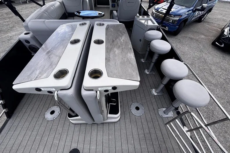 Slide: The Image of 2023 Starcraft CX 23 DL BAR pontoon boat with bar seating and modern interior design. - 46