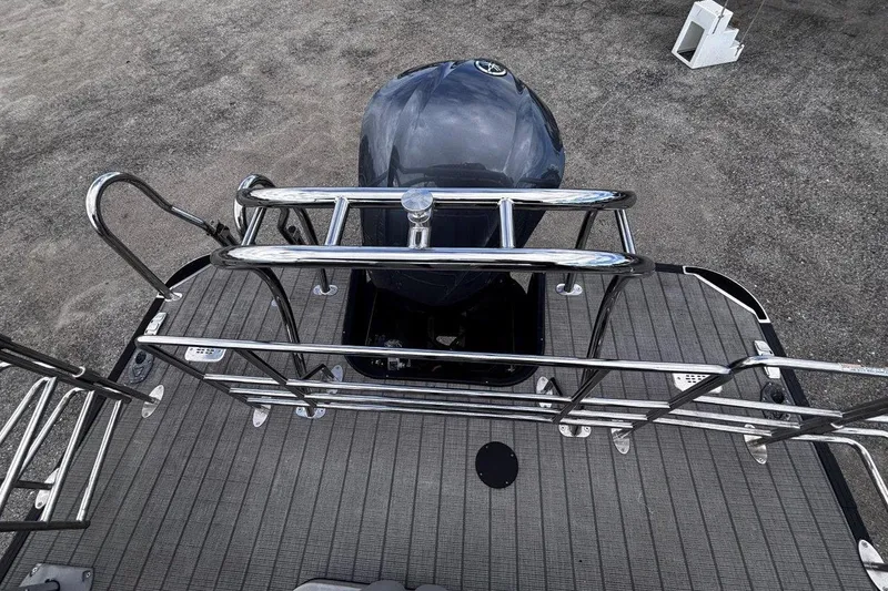 Slide: The Image of 2023 Starcraft CX 23 DL BAR boat deck with railing and outboard motor. - 50