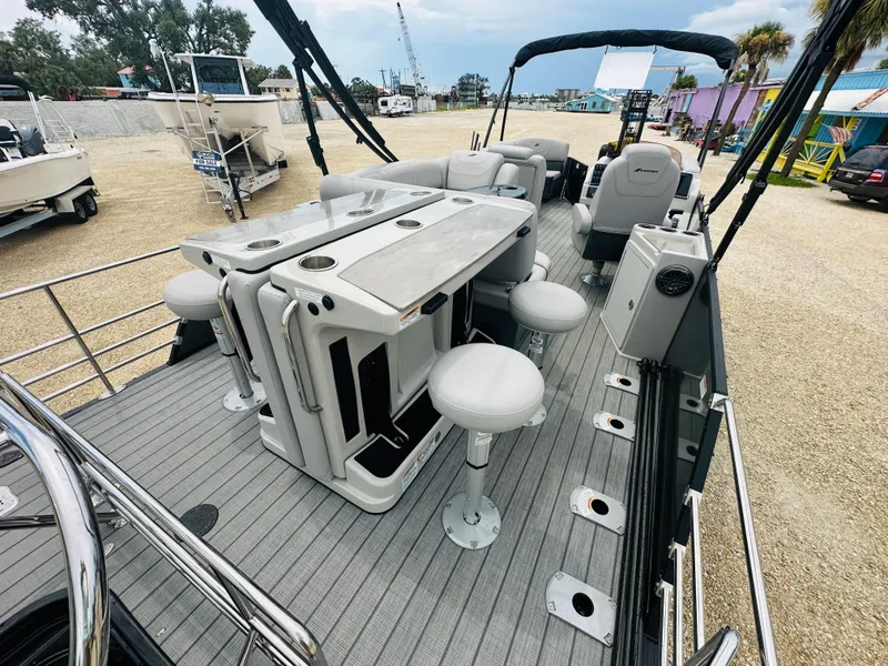 Slide: The Image of 2023 Starcraft CX 23 DL BAR pontoon boat with Yamaha outboard motor on trailer. - 7