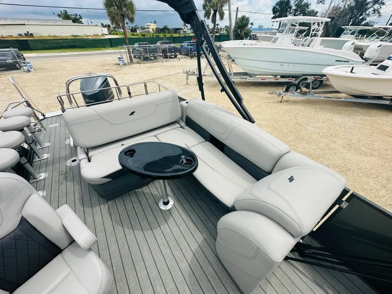 Slide: The Image of 2023 Starcraft CX 23 DL BAR pontoon boat with powerful outboard motor. - 9