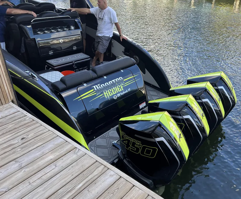 Slide: The Image of 2023 Mystic Powerboats M4200 with quad Mercury 450R engines docked. - 5