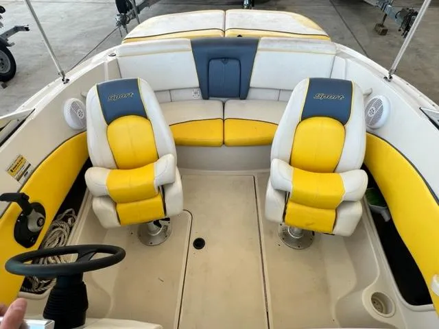Slide: The Image of 2006 Sea Ray 195 Sport boat interior with yellow and white seating. - 9