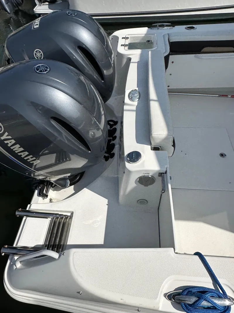 Slide: The Image of 2018 Edgewater 262CX boat with twin Yamaha outboard engines. - 22