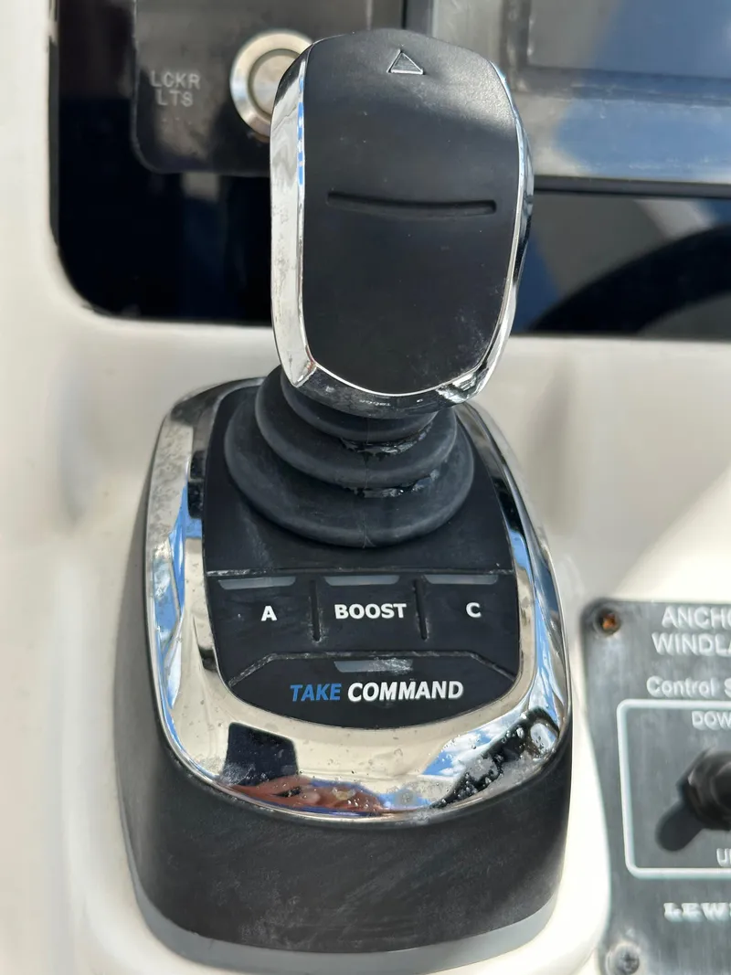 Slide: The Image of Edgewater 262CX 2018 boat control joystick with boost and command buttons. - 5