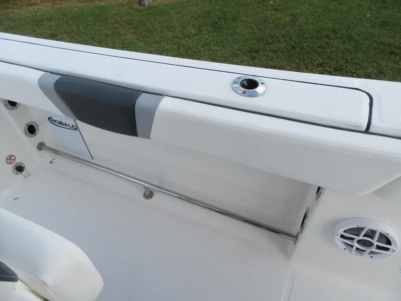 Slide: The Image of 2024 Robalo R230 Center Console boat interior with white seating and speaker. - 13
