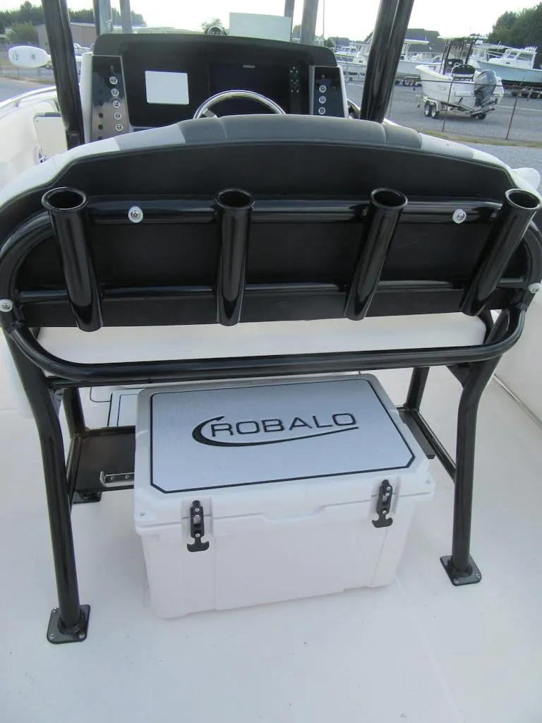 Slide: The Image of 2024 Robalo R230 Center Console boat with rod holders and cooler. - 15