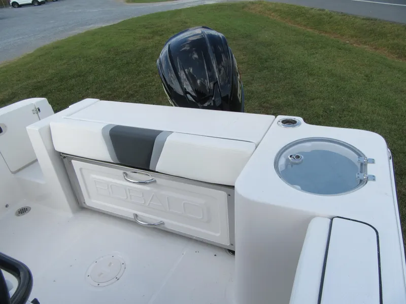 Slide: The Image of 2024 Robalo R230 Center Console boat interior with seating and storage. - 16