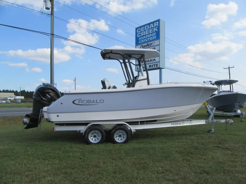 Slide: The Image of 2024 Robalo R230 Center Console boat on trailer at Cedar Creek Marine Center. - 19