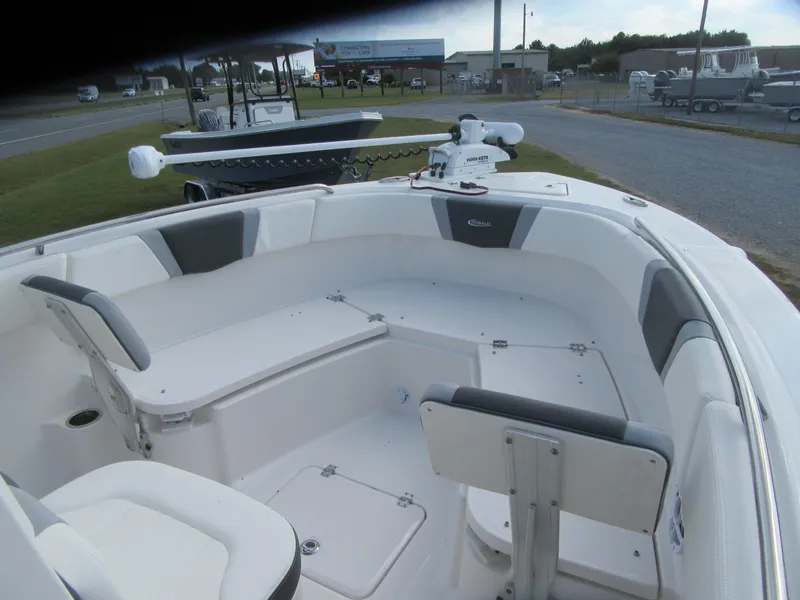 Slide: The Image of 2024 Robalo R230 Center Console boat with spacious seating and modern design. - 3