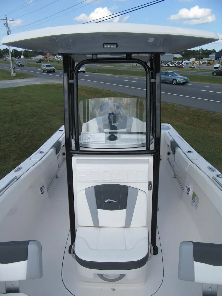 Slide: The Image of 2024 Robalo R230 Center Console boat with sleek design and spacious seating. - 5