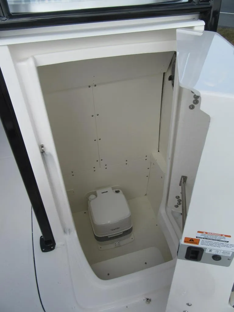 Slide: The Image of 2024 Robalo R230 Center Console boat interior storage compartment. - 6