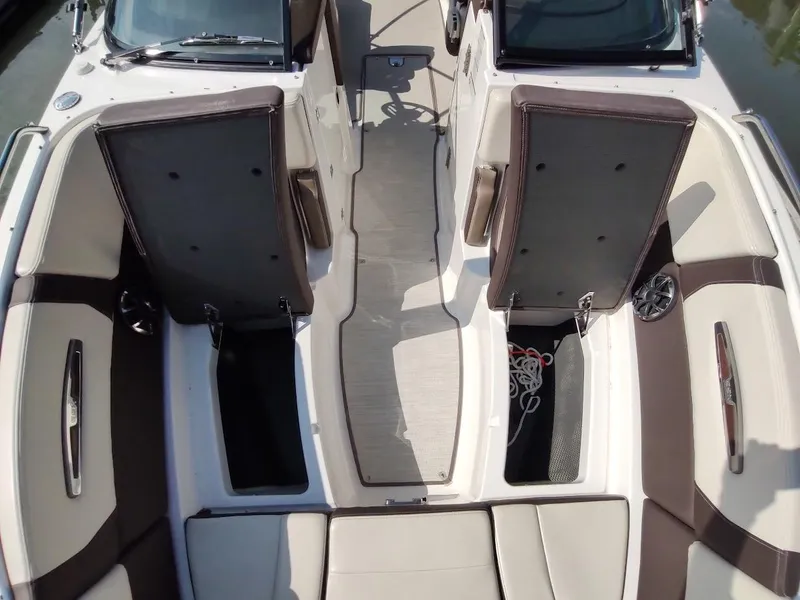 Slide: The Image of 2018 Chaparral 267 SSX boat interior with open storage compartments. - 11