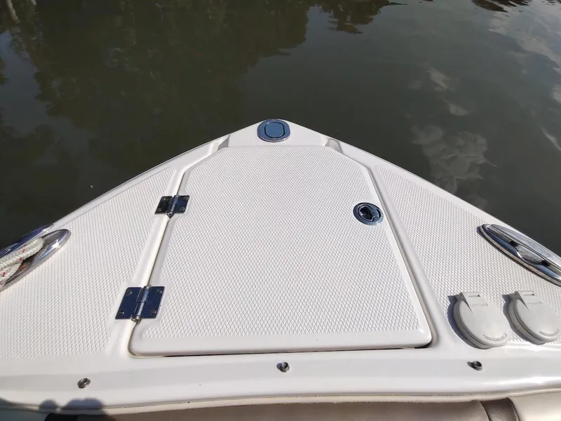 Slide: The Image of Bow of 2018 Chaparral 267 SSX boat on calm water. - 12