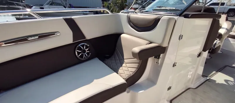 Slide: The Image of 2018 Chaparral 267 SSX boat interior with luxurious seating and modern design. - 17