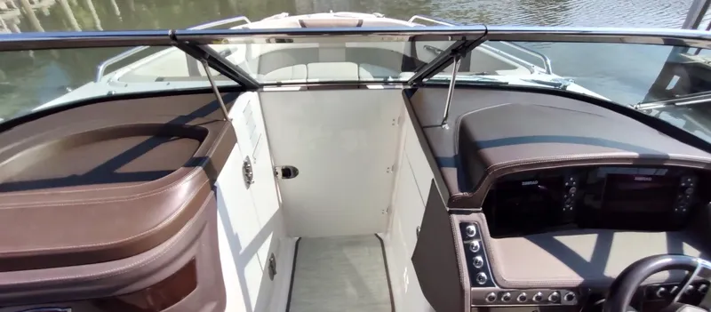 Slide: The Image of 2018 Chaparral 267 SSX boat interior with sleek dashboard and modern controls. - 20