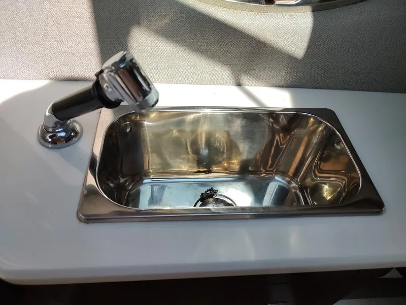Slide: The Image of Stainless steel sink with faucet in 2018 Chaparral 267 SSX boat interior. - 23