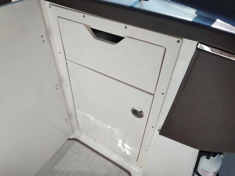 Slide: The Image of Storage compartment on 2018 Chaparral 267 SSX boat interior. - 27