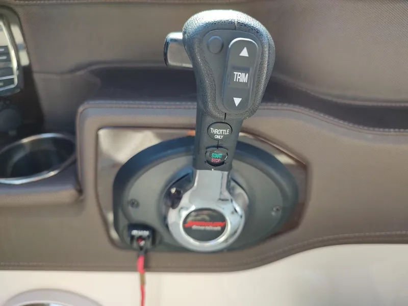 Slide: The Image of Throttle control of 2018 Chaparral 267 SSX boat with trim and start/stop buttons. - 37