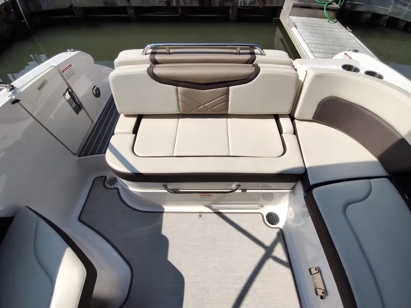 Slide: The Image of 2018 Chaparral 267 SSX boat interior with beige and brown seating. - 46