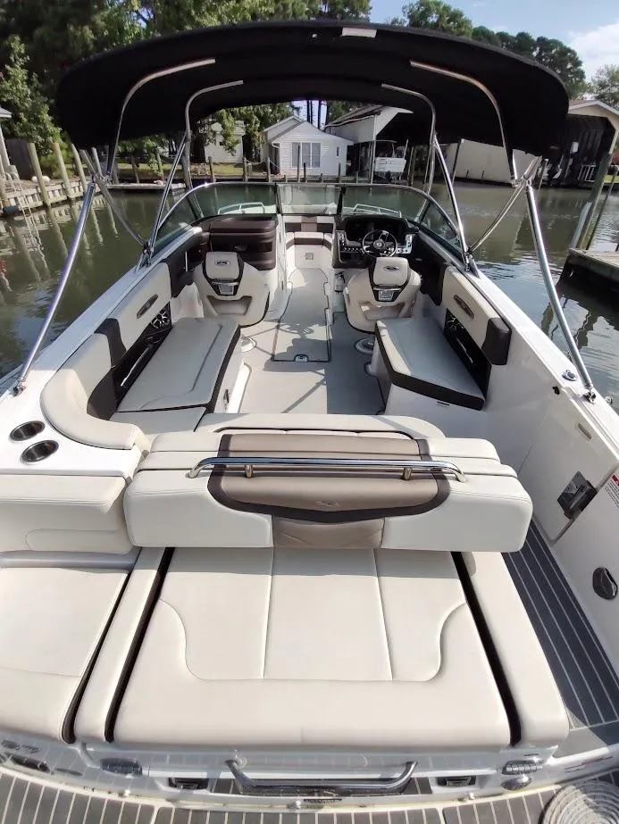 Slide: The Image of 2018 Chaparral 267 SSX boat interior with spacious seating and sleek design. - 6