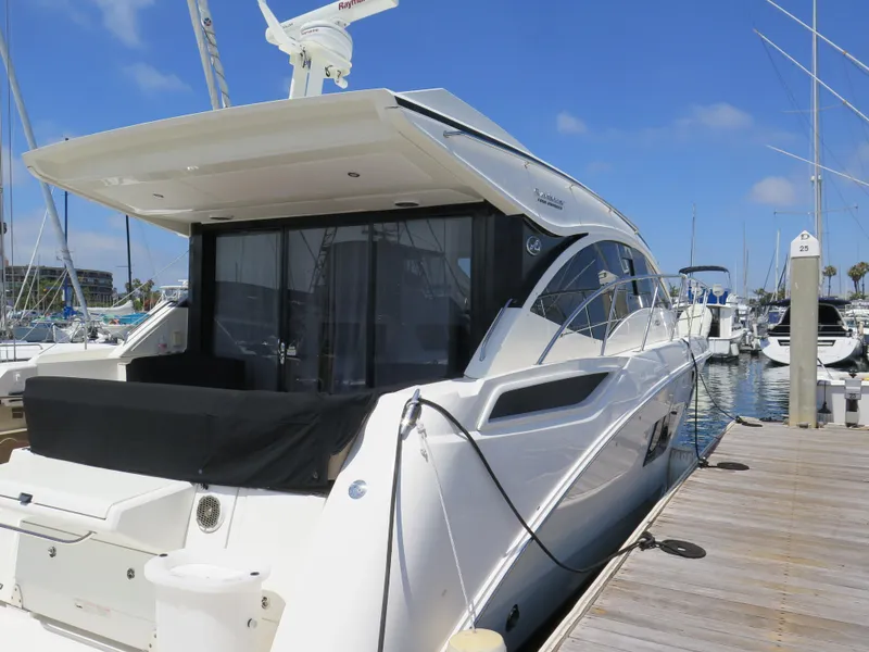 Slide: The Image of 2017 Sea Ray 400 Sundancer yacht docked at marina on a sunny day. - 39