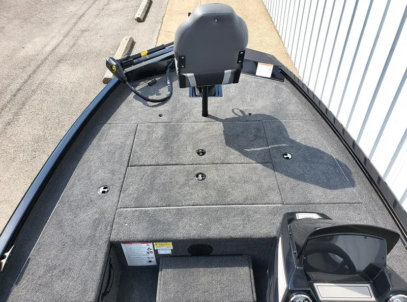 Slide: The Image of 2024 Lowe Stinger 175 fishing boat with spacious deck and seating. - 4