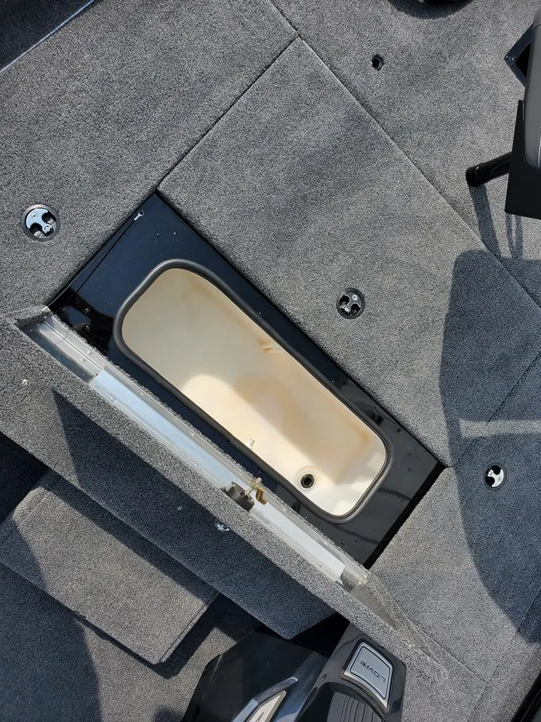 Slide: The Image of 2024 Lowe Stinger 175 boat interior storage compartment. - 6