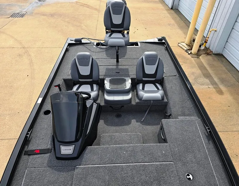 Slide: The Image of 2024 Lowe Stinger 175C boat interior with gray seating and carpeted deck. - 7