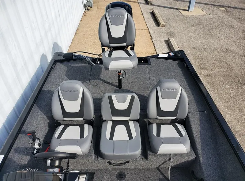 Slide: The Image of 2024 Lowe Stinger 175 boat interior with four gray and white seats. - 8