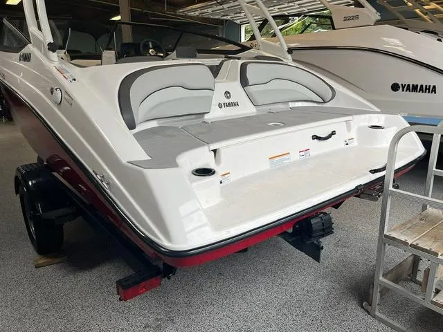 Slide: The Image of 2024 Yamaha Boats AR190, white and red, displayed indoors on a trailer. - 3