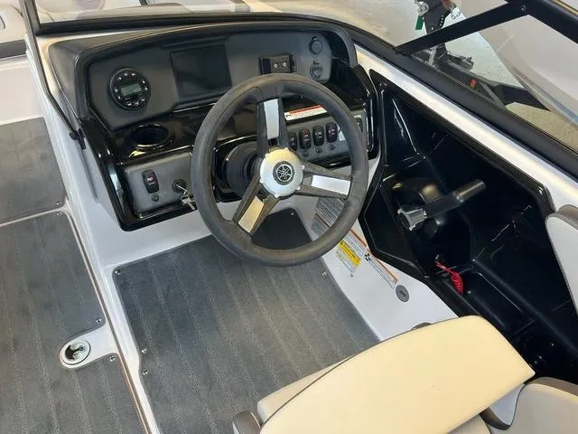 Slide: The Image of 2024 Yamaha Boats AR190 cockpit with steering wheel and control panel. - 5