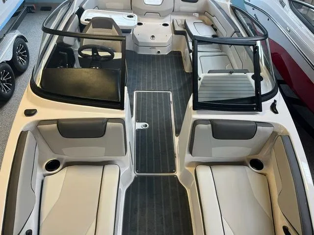 Slide: The Image of 2024 Yamaha Boats AR190 interior with seating and steering wheel, showcasing modern design. - 7