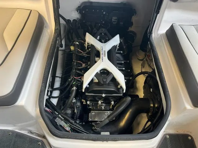 Slide: The Image of 2024 Yamaha Boats AR190 engine compartment, showcasing the powerful motor and clean interior design. - 8