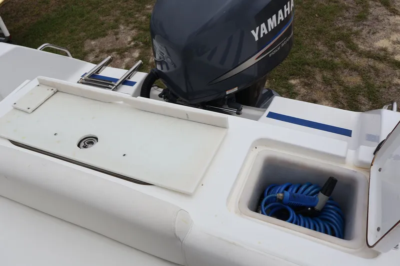 Slide: The Image of Sea Hunt 24 Gamefish 2010 with Yamaha motor and storage compartment. - 10
