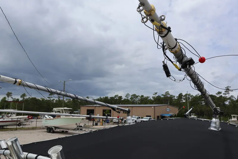 Slide: The Image of Sea Hunt 24 Gamefish 2010 with outriggers and cloudy sky. - 18